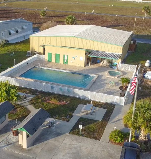 Aerial view of the clubhouse and pool at Orange Acres